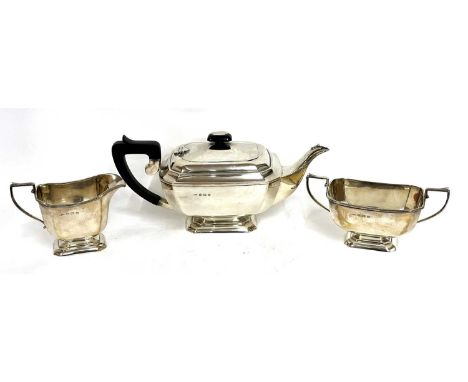 Art Deco silver three piece tea set of plain panelled form comprising teapot, sugar bowl and cream jug, hallmarked for Birmin