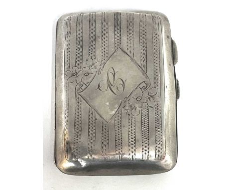 Edwardian silver cigarette case of typical form, chased and engraved around a cartouche, hallmarked for Chester 1914, makers 