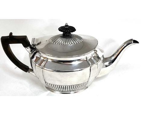 Victorian silver bachelors teapot of oval panelled form with fluted decoration, hallmarked for Birmingham 1898, makers mark f