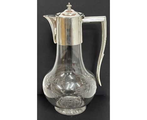 George V glass and silver mounted claret jug, the bulbous body engraved with tied ribbon and garland design, the plain silver