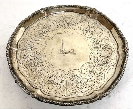 George III silver armorial footed small salver engraved with heraldic device of an arm holding a sword, within an engraved su