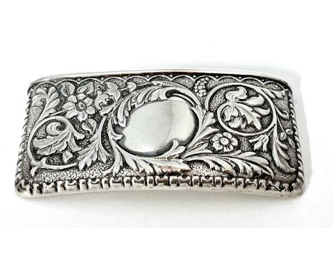 Edwardian silver card case of slight curved rectangular form, embossed with foliate and scrolls around a plain vacant cartouc