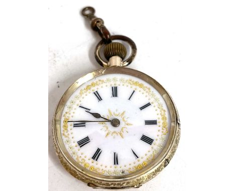 Yellow metal ladies pocket watch with a manually crown wound movement, the case is stamped in the back 9K, enamel dial with g