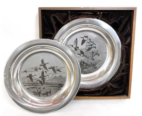 Two silver limited edition plates, 'The Peter Scott Christmas Plates', etched from the original work of art created by Peter 