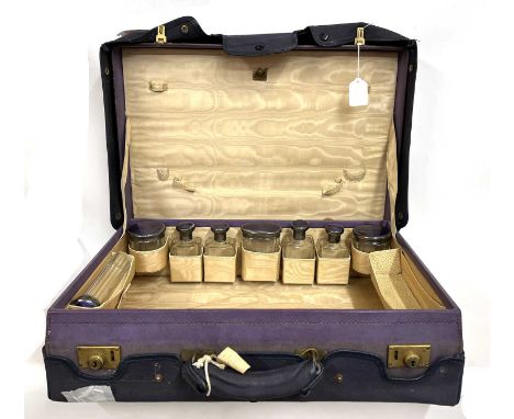 Vintage purple leather dressing case, part fitted with eight glass jars each with silver and purple guilloche enamel lids, ha