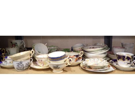 Shelf of mixed teacups and saucers to include Victorian examples. Not available for in-house P&amp;P 