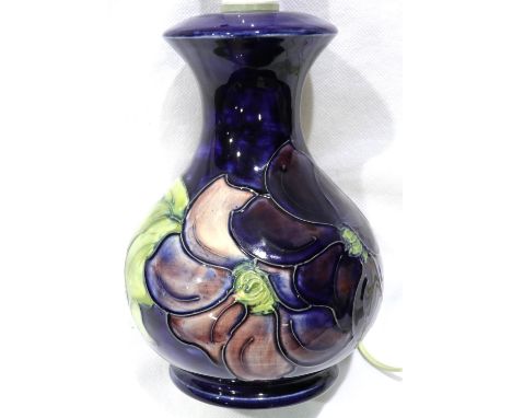 Moorcroft blue ground lamp in the Clematis pattern, H: 24 cm. P&amp;P Group 2 (£18+VAT for the first lot and £3+VAT for subse