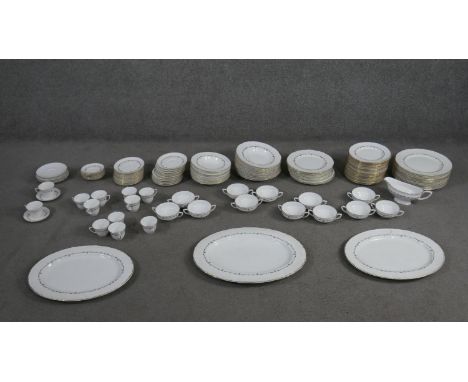A Royal Worcester gold Chantilly pattern part twelve person dinner service. (133 pieces) Maker's mark to the base along with 