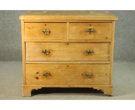 A Victorian pine chest of two short over three long graduated drawers, on shaped bracket feet. H,.83 W.96 D.45cm. 