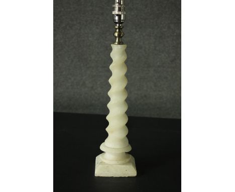 An alabaster table lamp, with a barley twist stem, on a square section base. H.42cm. 