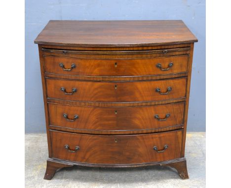 Early 20th century mahogany bow fronted chest with brushing slide over four long graduated drawers on bracket base