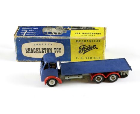 Shackleton Foden  clockwork diecast model flatbed lorry with blue cab and bed, red wheel arches , in original box with instru