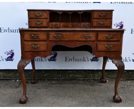 1920's mahogany desk, top structure with drawers, base with five, on cabriole legs to claw and ball feet 