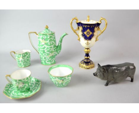 Coalport three handled cup, the reserve panel with painted landscape, 22cm Royal Doulton figure of a grey sow, and a Noritake