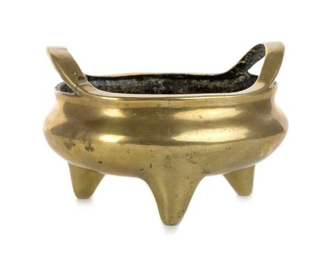 CHINESE TWIN HANDLED BRONZE CENSER, EARLY 20TH CENTURY of circular form, raised on tripod feet, bearing sixteen character mar