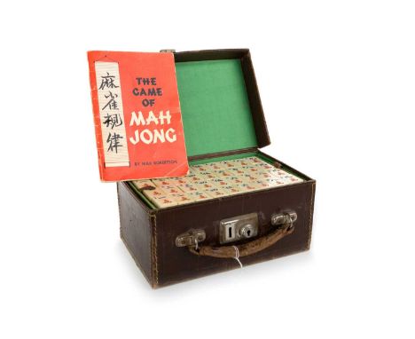 CHINESE MAHJONG SET, MID 20TH CENTURY carved and coloured bone and bamboo counters, housed in a tan leather case, over five l