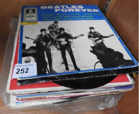 A collection of vintage records including Beatles records
