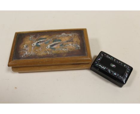 A MOTHER OF PEARL INLAID SNUFF BOX TOGETHER WITH A COPPER LIDDED WOODEN BOX DECORATED WITH FISH (2)