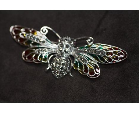 A LARGE SILVER PLIQUE A JOUR WINGED INSECT BROOCH / PENDANT, set with cabochon ruby eyes and marcasites