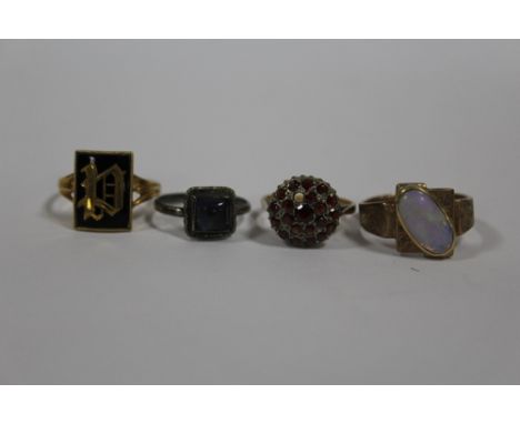 A HALLMARKED 9 CARAT GOLD GARNET CLUSTER RING (MINUS ONE STONE) TOGETHER WITH THREE OTHER RINGS (4) 