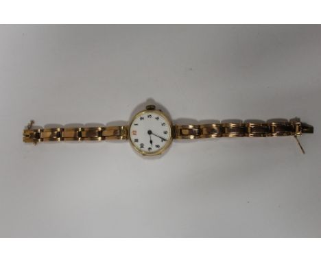 A VINTAGE HALLMARKED 9 CARAT GOLD CASED  WRISTWATCH WITH ENAMEL DIAL ON 9CT GOLD EXPANDABLE BRACELET 