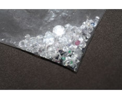 A BAG OF LOOSE MIXED STONES,  including cubic zirconia, ruby, sapphire and emerald 73.55ct