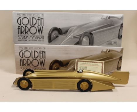 A BOXED SCHYLLING GOLDEN ARROW WIND UP MOTOR MODEL