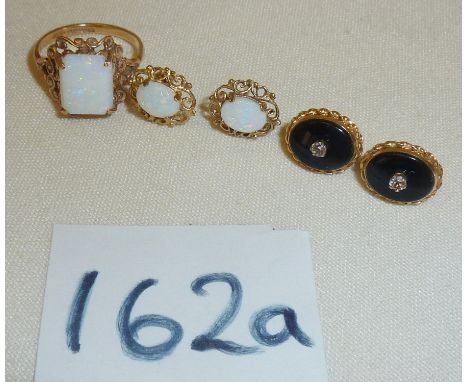 A 9ct gold opal ring with matching earrings and another pair of earrings