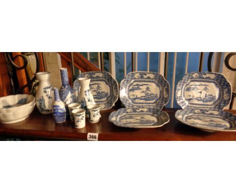 Shelf of assorted Oriental blue and white china vases and dishes inc. Sake bottles and Chinese dishes