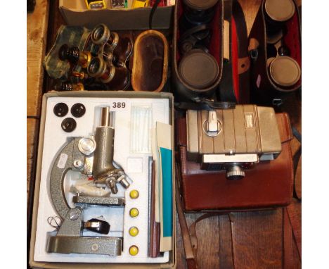 Old cased binoculars and opera glasses, two vintage pairs of binoculars, microscope and Bell &amp; Howell 624EE camera