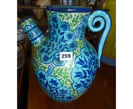 19th century&nbsp; 'Persian' pattern thrown pottery ewer possibly by William de Morgan, with all over floral decoration in tu