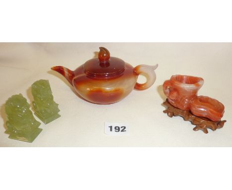 Chinese carved agate brush washer on wooden stand together with a teapot and pair of lion figures