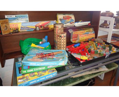 Large collection of games including Scalex, clockwork motor yacht, Octopus student's microscope, Chad Valley building sets