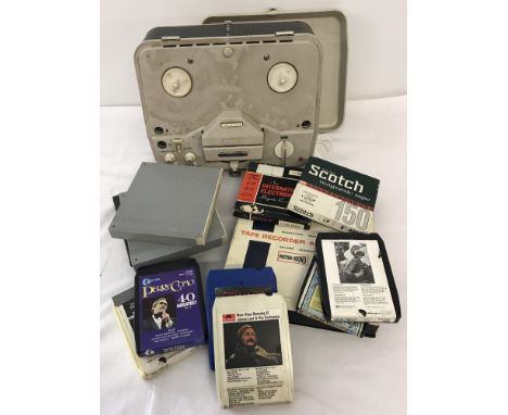A vintage Grundig TK400 Automatic reel to reel audio player and tapes. Together with an accessories kit and extra tapes and s