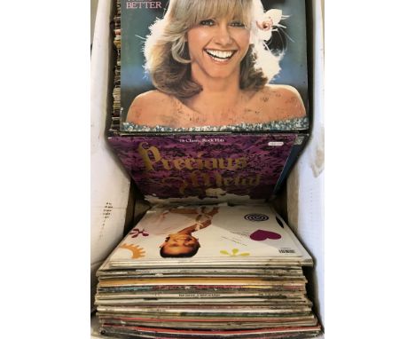 A large quantity of vintage vinyl LP records. To include several Billy Vaughn, Alf Garnett, Genesis and Klaus Wunderlich. 