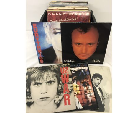 A tub of 52 assorted vintage vinyl LP records. To include; Phil Collins, Eurythmics, Hall & Oates, U2 and Michael Jackson. 