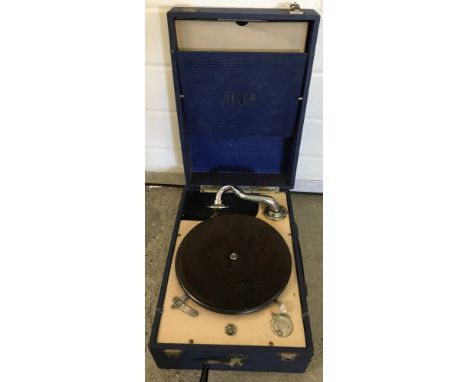 A vintage Decca portable gramophone with a small selection of 78 records. case needs attention. With built in wind up handle.