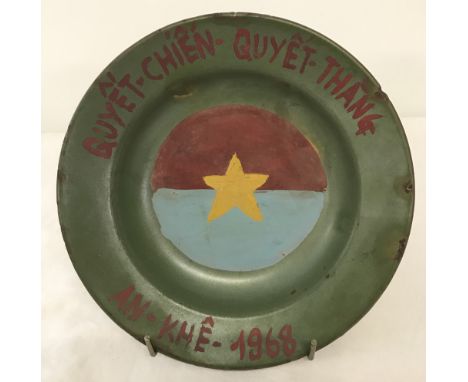 Vietnam War Era Vietcong trench art enamel plate. With hand painted detail. Approx. 20cm diameter.