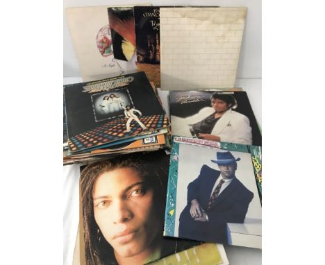 A collection of 12 inch records and LP's. To include Pink Floyd The wall without front cover writing, Queen, Toyah and Michae