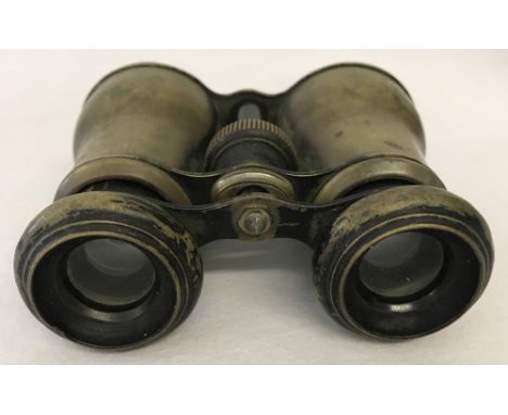 Vintage binoculars with integral compass. One lens missing 