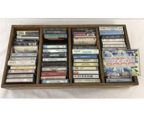 A wooden tray containing 50 vintage music tapes. To include; Boomtown Rats, Backstreet Boys, Bros and Mariah Carey. 