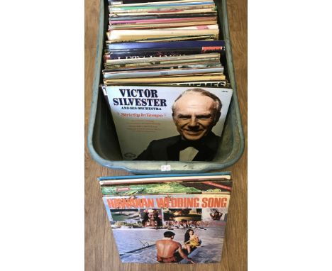 A box of assorted vintage vinyl LP records, mostly classical, musicals and world music.  