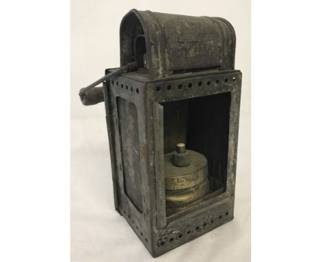German WWII pattern train lantern with wooden handle and marked with eagle and swastika motif. Marked to front "Josef Schneeb