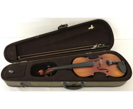 A vintage cased West German copy of an Antonio Stradivarius Faciebat Cremona violin. 3/4 size, complete with bow and resin. A