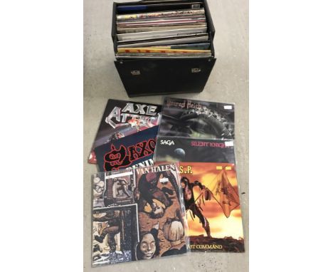 A vintage black record case containing a quantity of vinyl LP records To include; Saxon, WASP, AC/DC, Rainbow and Elvis. Some