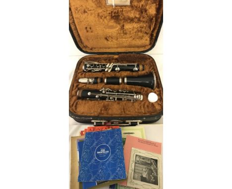 A vintage cased LaFleur Boosey and Hawkes clarinet complete with cleaning rod, wax and reeds. Together with quantity of music