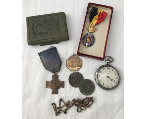 A small collection of military items. To include a stopwatch with engine turned decoration, military sunscreen camouflage fac