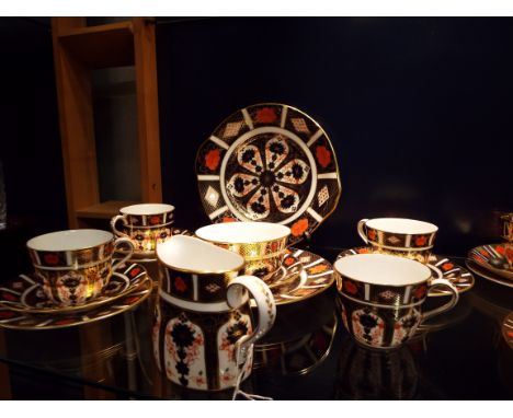 A selection of Crown Derby Imari pattern tea-ware to include plates, cups, saucers, sugar bowl and cream jug