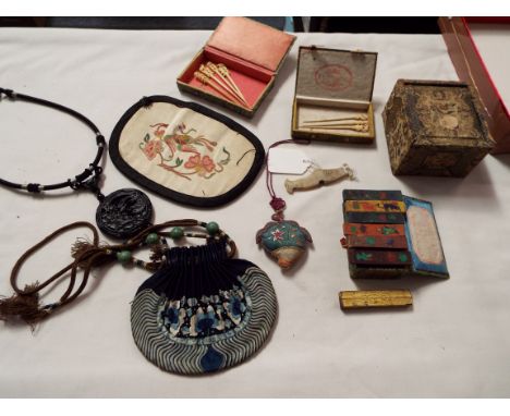 A selection of Chinese embossed purse, necklace with jade beads etc       Jade toggle has some pattern wearing but no chips o