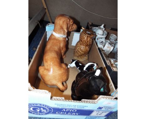 An Italian ceramics dachshund and Royal Doulton figure of a gun dog together with a ceramic owl and seated cat